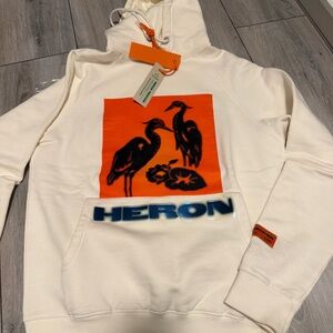 Heron Preston Cream Hoodie with Orange Graphic and Blue Logo